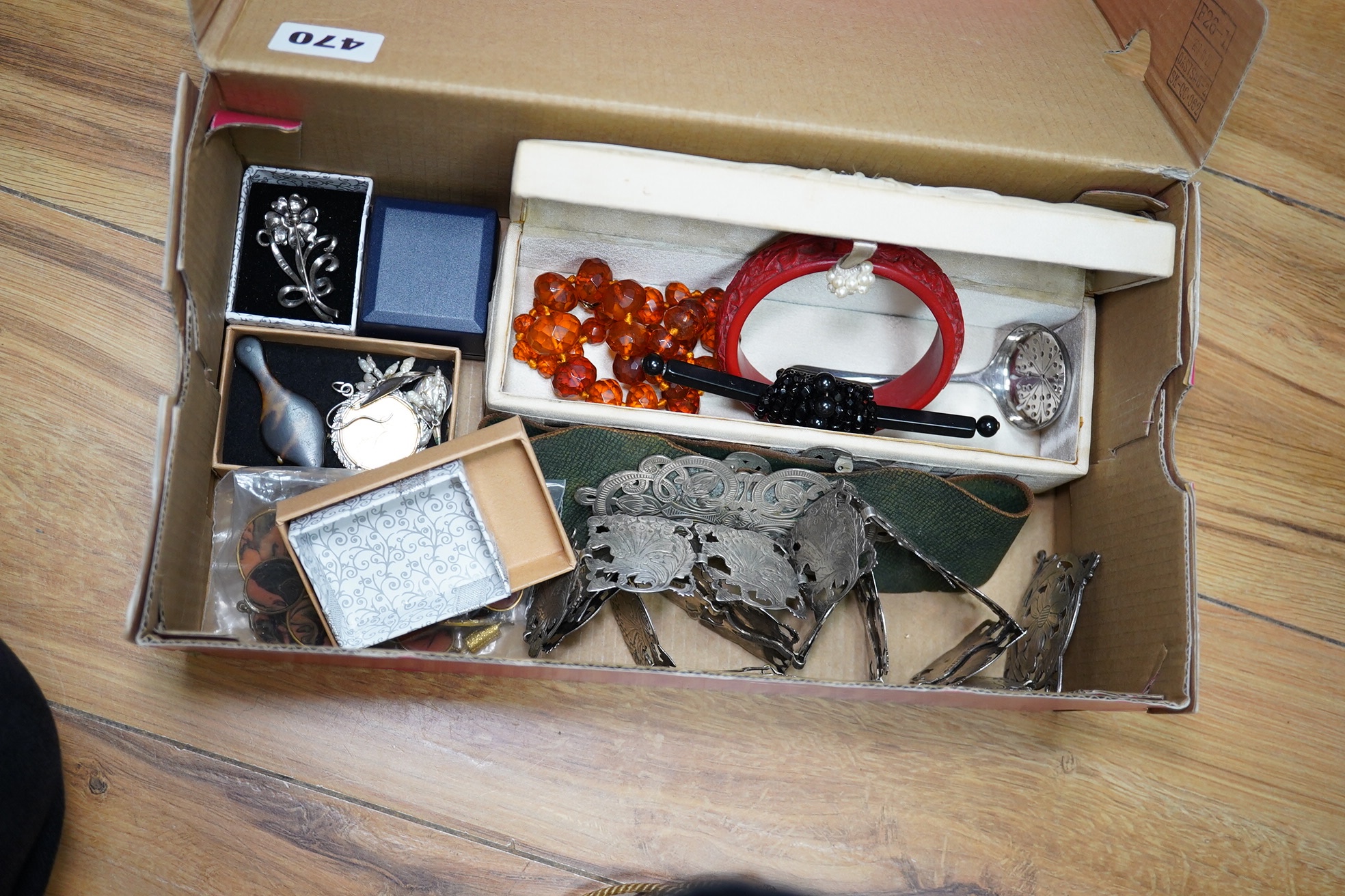 A silver plated ornate lady's belt, various items of costume jewellery, two beaded evening bags and a black jet mounted bag. Condition - varies
